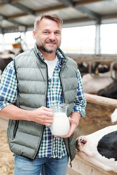 happy-young-worker-of-dairy-farm-holding-jug-with-resize.jpg happy-young-worker-of-dairy-farm-holding-jug-with-resize.jpg
